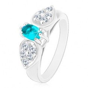 Šperky eshop - Lesklý prsteň v striebornom odtieni, ligotavá mašlička s modrým oválom R42.18 - Veľkosť: 54 mm