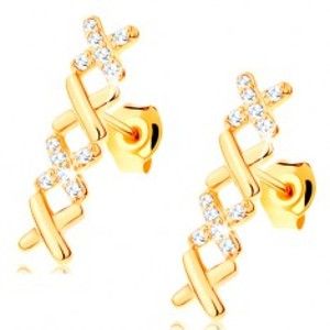 Šperky eshop - Náušnice v žltom 14K zlate - dva hladké a dva zirkónové krížiky GG114.12