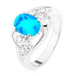 Šperky eshop - Prsteň striebornej farby, veľký modrý oválny zirkón, asymetrické línie R48.29 - Veľkosť: 49 mm